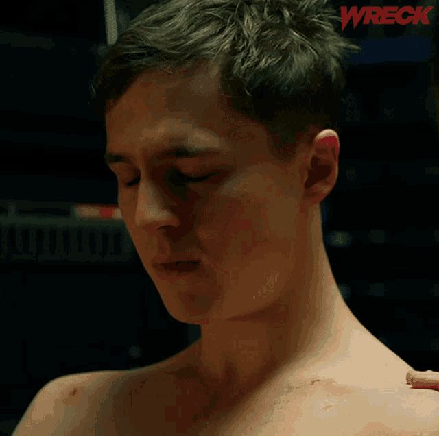 a shirtless man says she 's dead on a poster