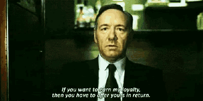 a man in a suit and tie says if you want to earn my loyalty , then you have to offer yours in return .