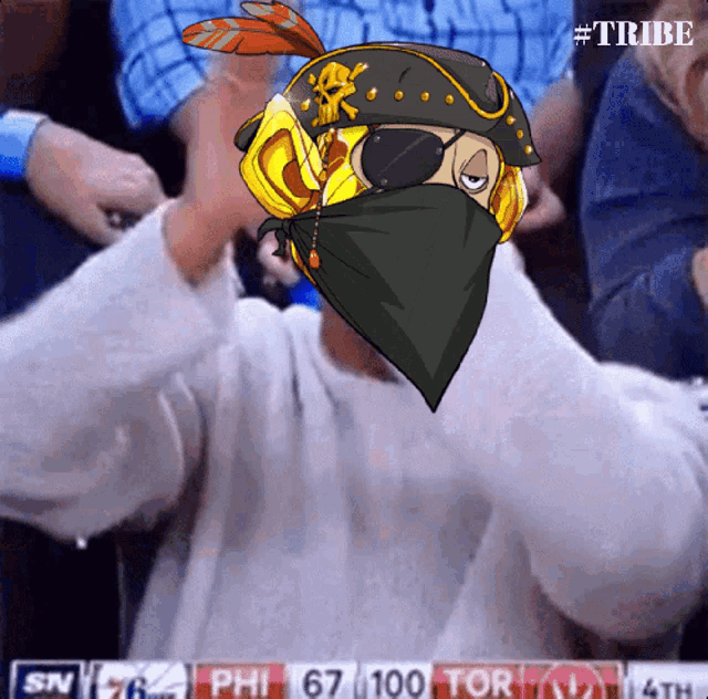 a man wearing a bandana and a pirate hat is watching a basketball game on sn
