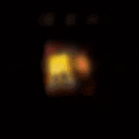 a blurry picture of a person holding a bag of doritos chips
