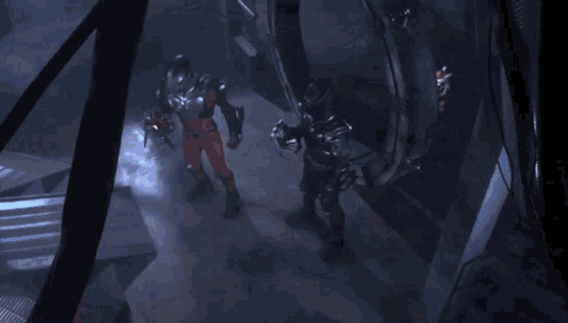a couple of people are standing in a dark room with a large circle in the background