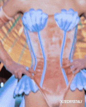 a close up of a woman 's face with xtecrystali written in the corner