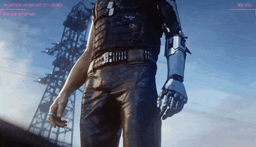 a man with a robotic arm is standing in front of a power pole