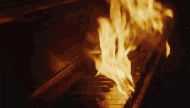 a piano is on fire with flames coming from the keys