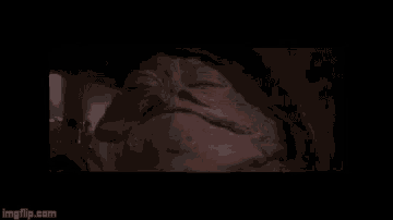 a close up of jabba the hutt 's face in star wars .