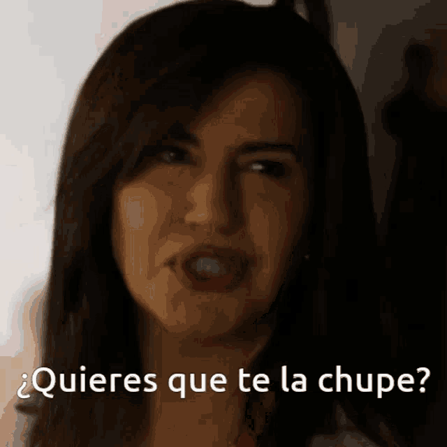 a close up of a woman with the words quieres que te la chupe below her