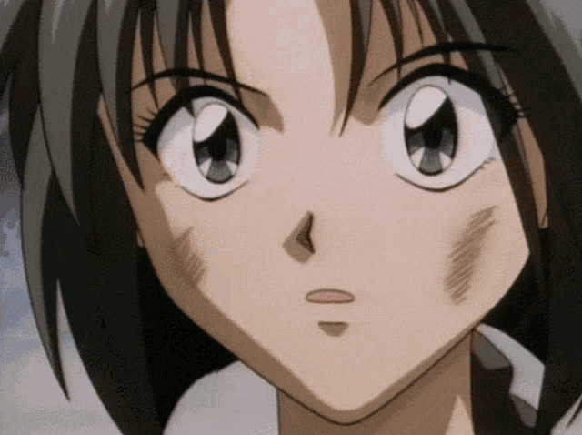 a close up of a cartoon character 's face with a scratch on her face