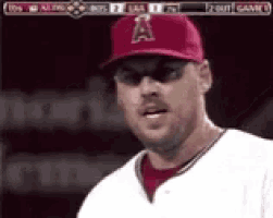 a baseball player wearing sunglasses and a red hat with the letter a on it
