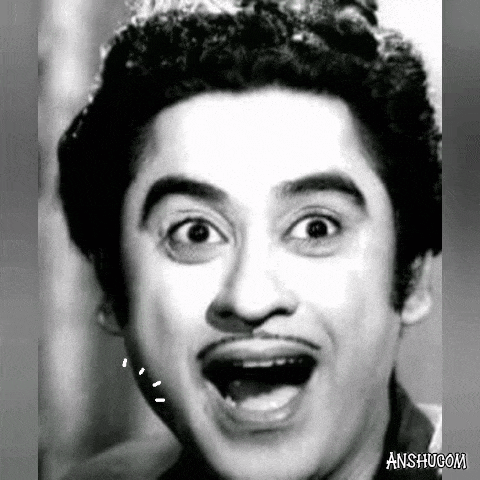 a man with a mustache is making a funny face with his mouth open .