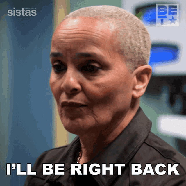 a woman says i 'll be right back in front of a sign that says sistas