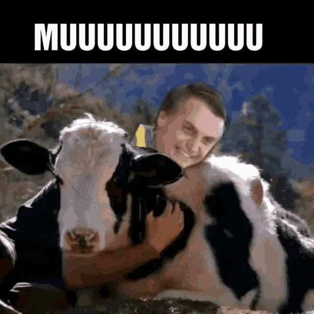 a man is hugging a black and white cow with the words muuuuuuuu written on the bottom