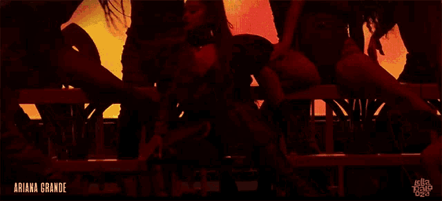 ariana grande is shown in a video with a bunch of dancers