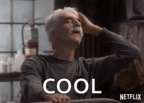 a man with a mustache holds his hand to his head and the word cool is on the screen