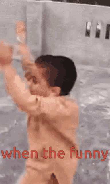 a boy is swimming in a pool with the words " when the funny " below him