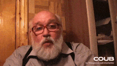 a man with glasses and a beard has the word coub on the bottom right