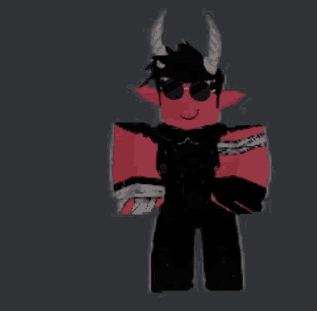 a red devil with horns is wearing sunglasses and a black jacket .