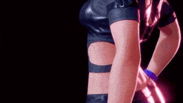 a close up of a woman 's torso with a purple light behind her