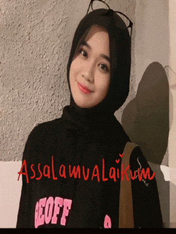 a woman wearing a hijab and a shirt that says eoff on it