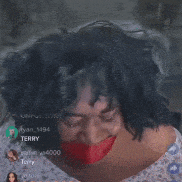 a woman with a red tape around her mouth is making a funny face .