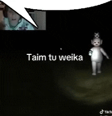 a teletubbies doll is standing in the dark with a speech bubble saying taim tu weika .