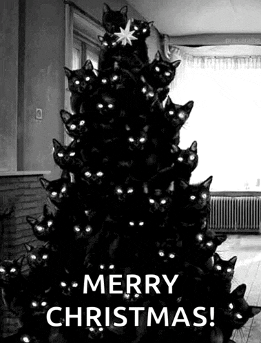 a christmas tree made out of black cats with glowing eyes .