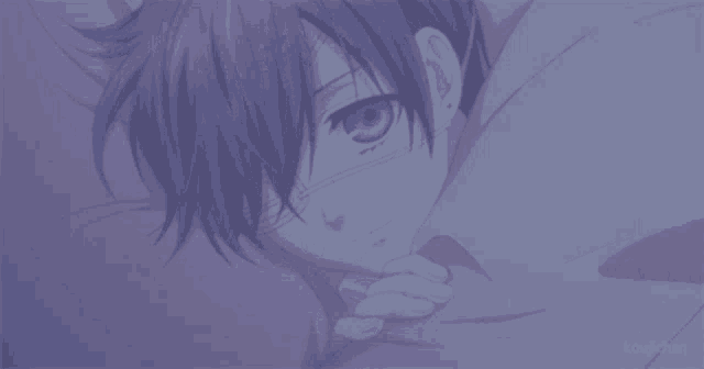 a boy with a bandage on his eye laying on a bed