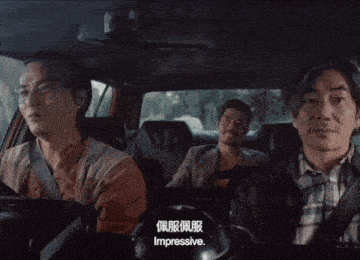 three men are in a car and one of them says impressive in chinese
