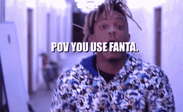 a man with dreadlocks is standing in a hallway with the words pov you use fanta above him