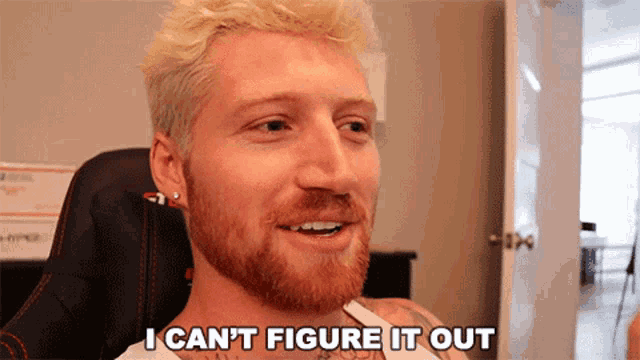 a man with blonde hair and a red beard says i can t figure it out