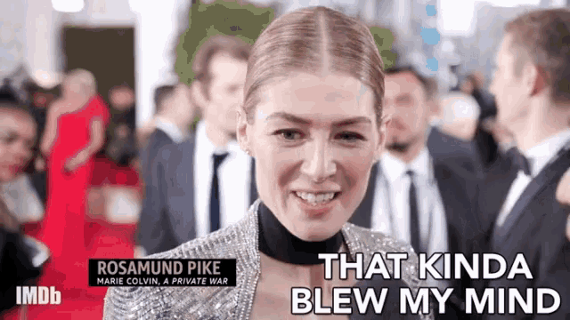 a woman with the name rosamund pike on her shoulder