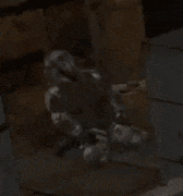 a soldier in a video game is holding a gun in a dark room .