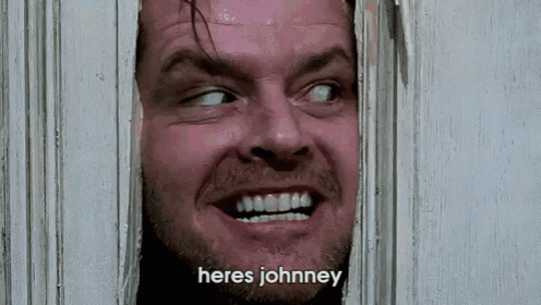 a close up of a man looking through a door with the words heres johnney written below him