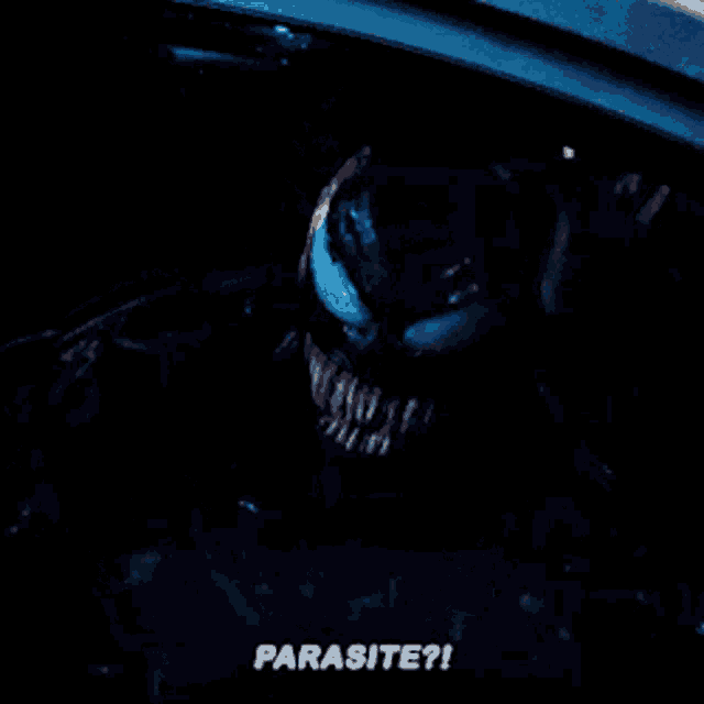 a close up of a person in a car with the words parasite written below them