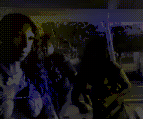 a black and white photo of a group of people standing next to each other