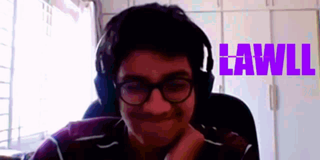 a man wearing headphones and glasses is smiling with the word lawli in the background