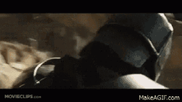 a close up of a person wearing a helmet in a movie clip