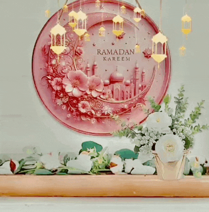 a pink plate with a picture of a mosque and the words " ramadan kareem " on it