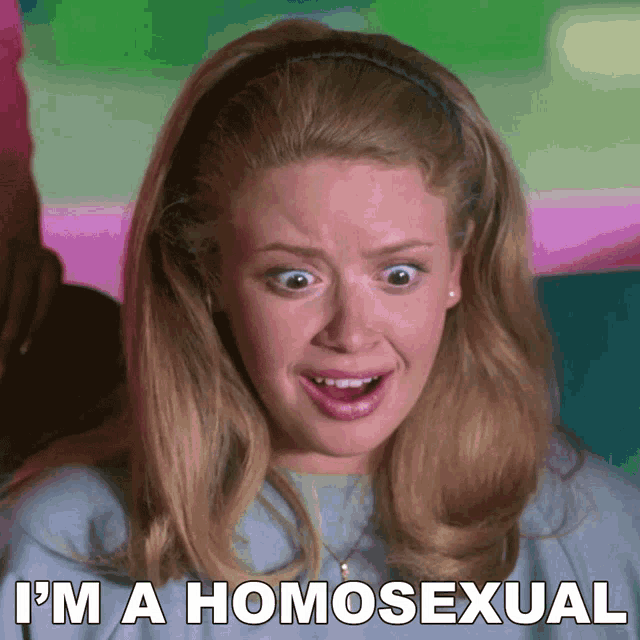 a woman is making a funny face with the words " i 'm a homosexual " behind her