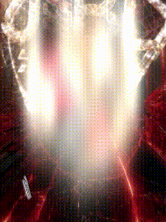 a close up of a light coming out of a hole in a wall