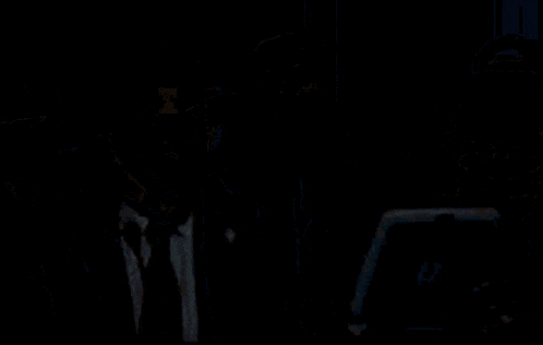a man in a suit and tie is holding a blue tablet with the letter o on the screen