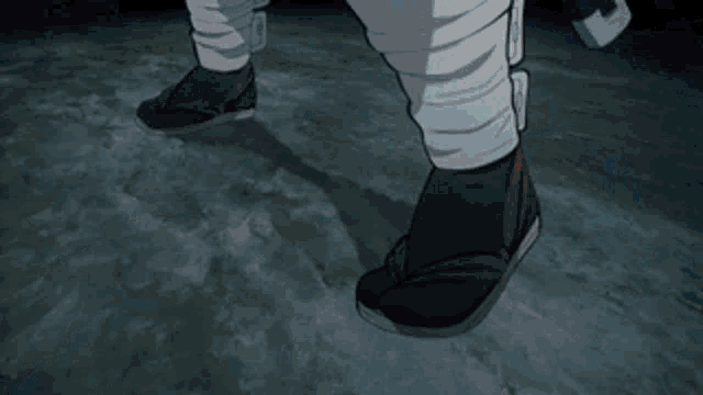 a close up of a person 's feet with bandages on them .