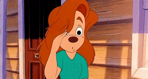 a cartoon character with red hair is standing in front of a wooden building .