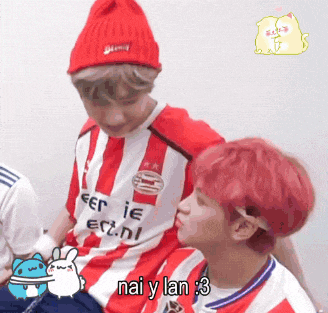 a boy in a red and white striped shirt says nai y lan