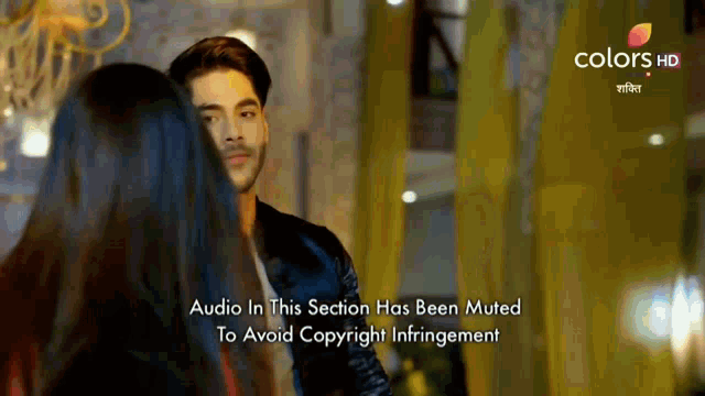 a man and a woman are standing next to each other with the words audio in this section has been muted to avoid copyright infringement