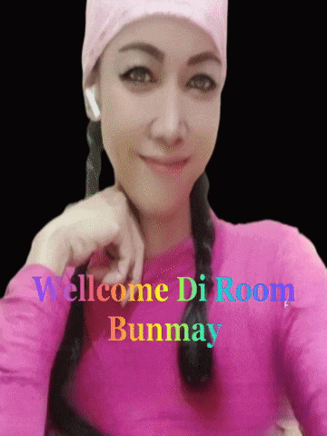 a woman wearing a pink shirt with the words welcome di room bunmay