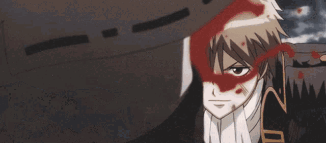 a close up of a person 's face with blood on it