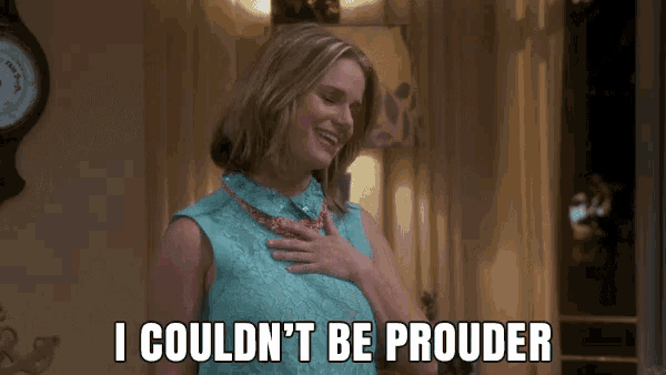 a woman with her hand on her chest and the words i couldn 't be prouder below her