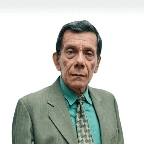 a man in a suit and tie with a green shirt