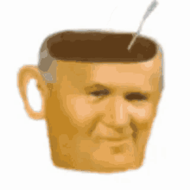 a coffee cup with a man 's face and a spoon in it .