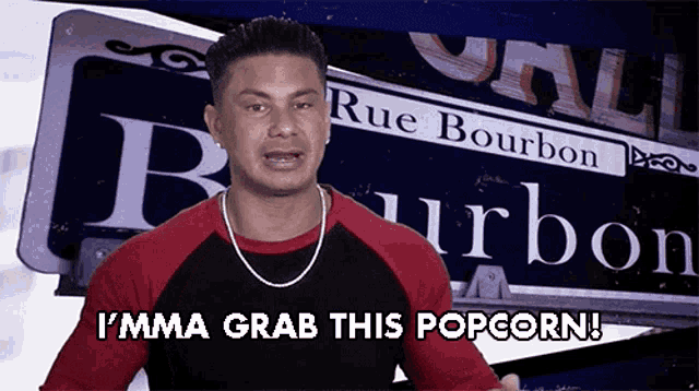 a man says i 'mma grab this popcorn in front of a sign that says rue bourbon